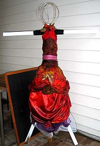 Creative scarecrow with an evening gown